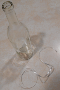 wine bottle, stuck cork, and ribbon